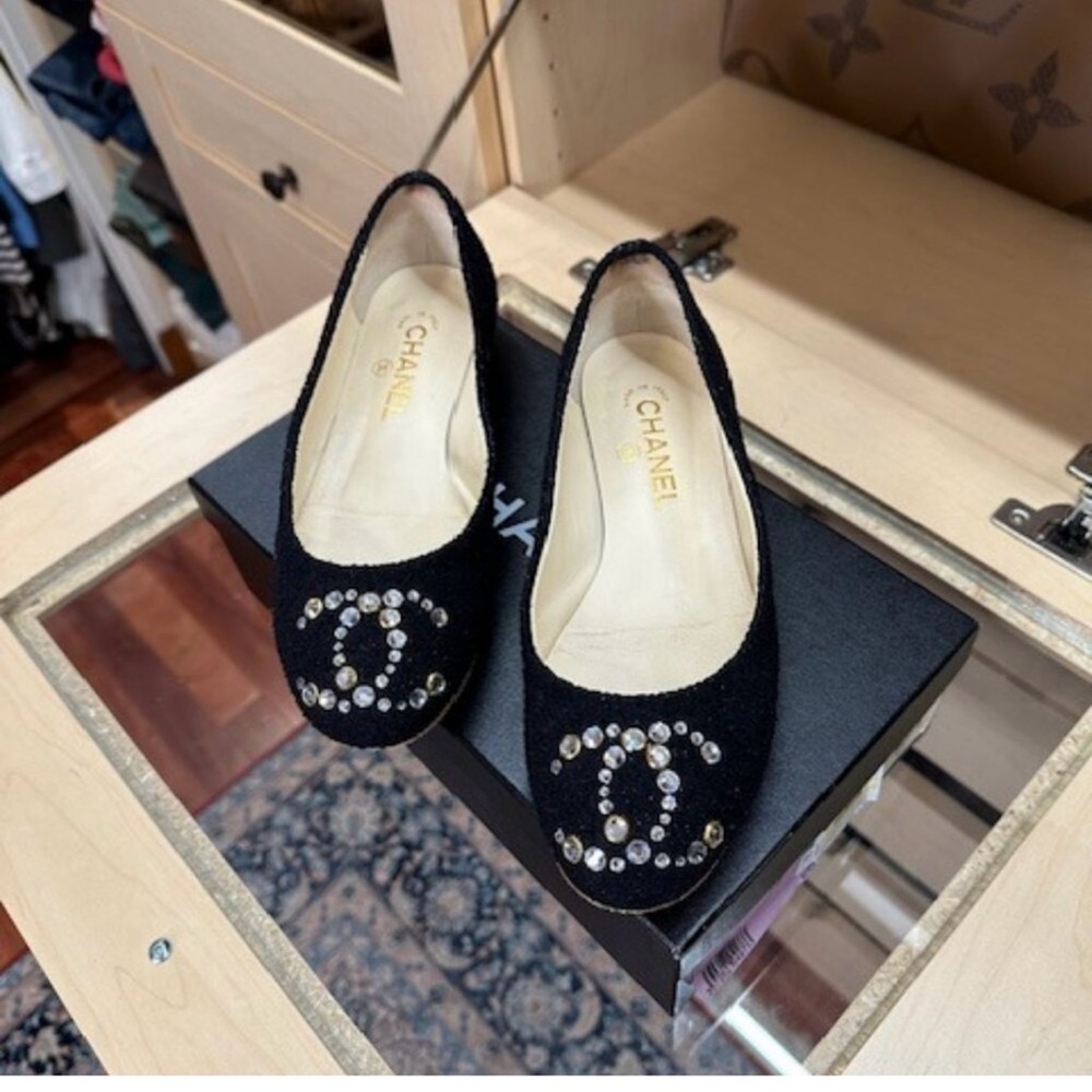 CHANEL Black Flats with Embellished Logo